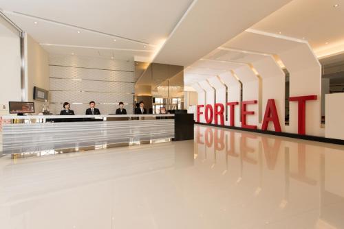 a store lobby with a for rent sign on the wall at Forte Hotel Changhua in Changhua City
