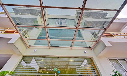 an image of a glass ceiling in a building at Treebo Vapr Guindy Ekkatuthangal in Chennai