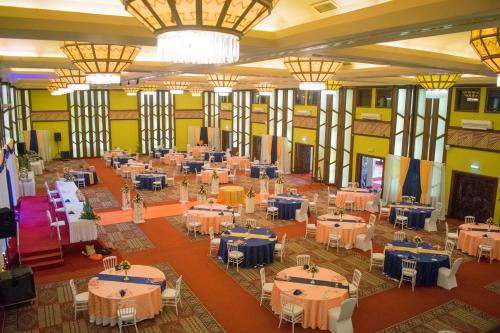 an image of a banquet hall with tables at Safari Park Hotel in Nairobi