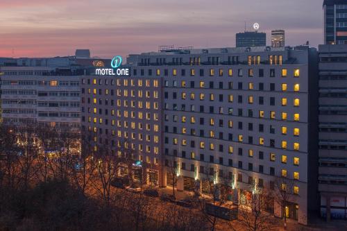 a building with a sign on the side of it at Motel One Berlin-Tiergarten in Berlin