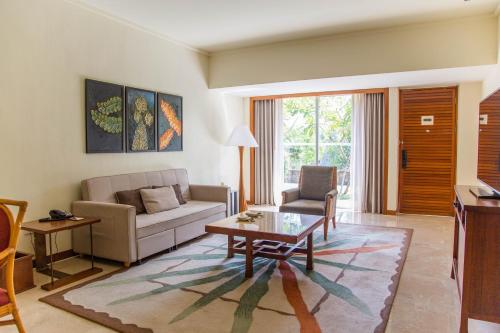 a living room with a couch and a coffee table at Mandarin Oriental, Sanya in Sanya