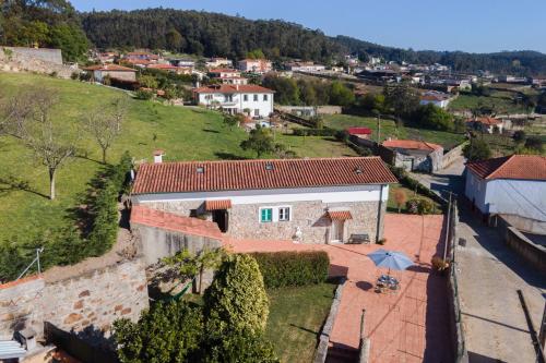 an aerial view of a house in a village at Casa da Cerca in Fornelo