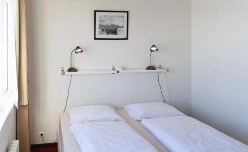 Ein Bett oder Betten in einem Zimmer der Unterkunft Hótel Dalvík