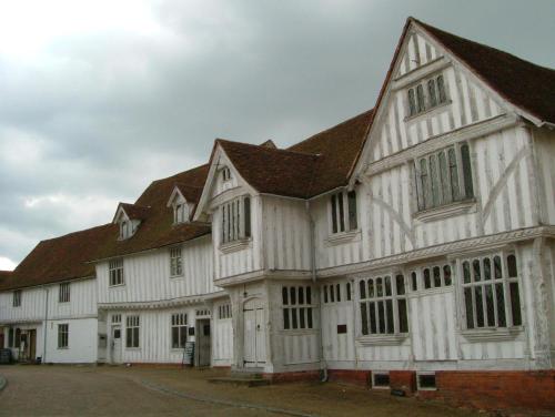 a large white building with a brown roof at The Swan Inn in Monks Eleigh