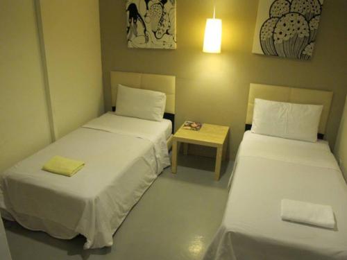 Postel nebo postele na pokoji v ubytování 7 Star Hotel