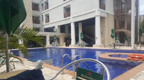 a large swimming pool in front of a building at Full Moon Hotel - Premiere in Owerri