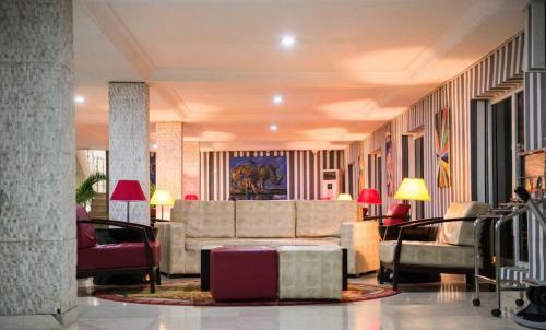 a lobby with a couch and chairs in a building at Grand Ibro Hotel - Standard in Jabi
