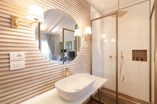 a bathroom with a sink and a mirror at Villa Francesca Relais in Gradara