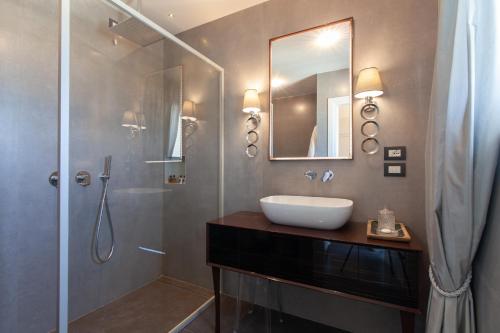 a bathroom with a sink and a shower at Villa Francesca Relais in Gradara