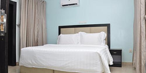 En eller flere senge i et værelse på Room in Lodge - The Beckett Suites