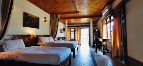 Voodi või voodid majutusasutuse Jinja Nile Resort toas
