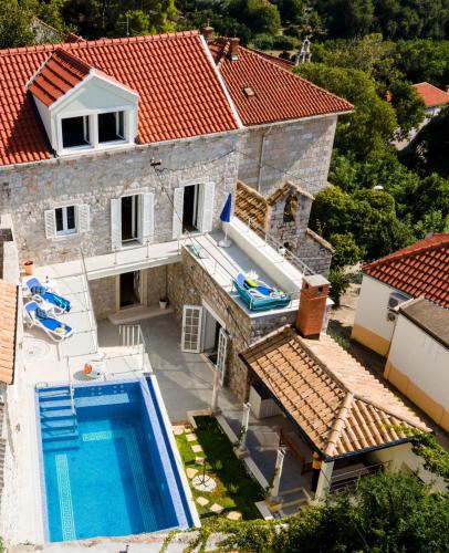 an aerial view of a house with a swimming pool at Villa Baburizza in Koločep