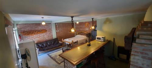 a living room with a couch and a table at Maryfer in Las Grutas
