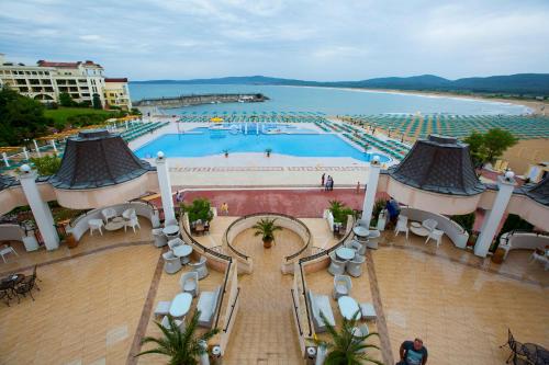 a view of a swimming pool in a resort at Duni Marina Beach Hotel - All Inclusive in Sozopol