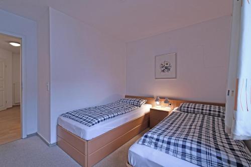 Postel nebo postele na pokoji v ubytování BER-511-Appartementresidenz