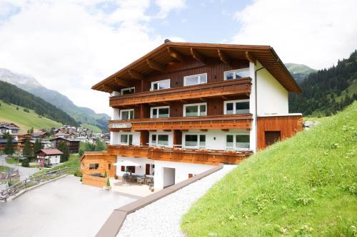 a house on the side of a hill at Soldanella in Lech am Arlberg