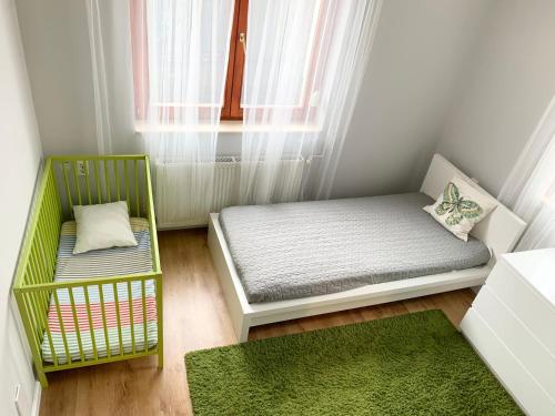 Ein Bett oder Betten in einem Zimmer der Unterkunft Happy Mammy Bababarát Vendégház Fészek utca