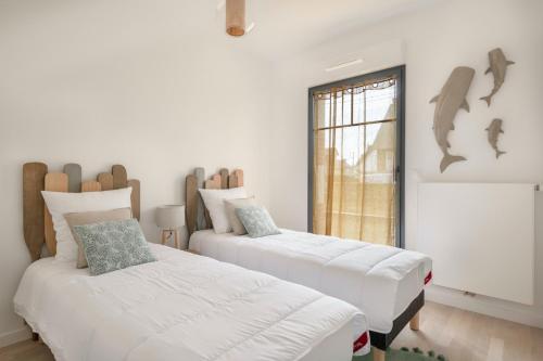 Postel nebo postele na pokoji v ubytování À 50m de la plage, bel appartement pour 4