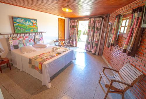 Ένα ή περισσότερα κρεβάτια σε δωμάτιο στο Hotel Pousada Arizona