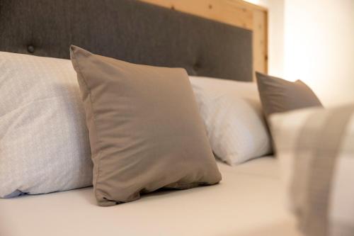 a row of white pillows sitting on a bed at Ferienwohnung Sonja in Elmen