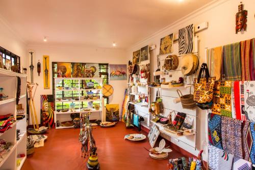 a room with a lot of items on the wall at Airport Planet Lodge in Kingori