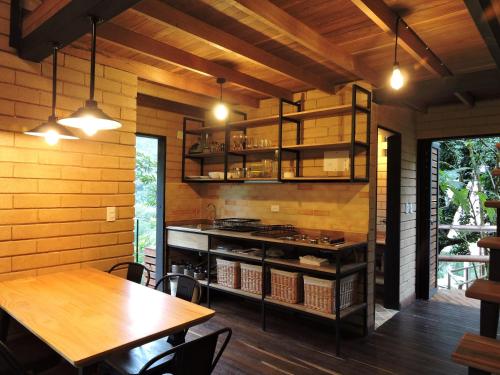 a kitchen with tables and a stove in a room at Palagua Lodge in San Rafael
