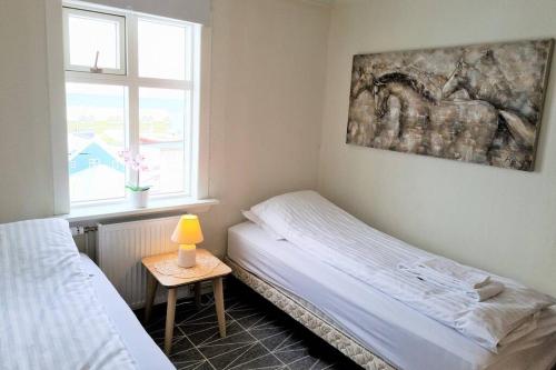 Postel nebo postele na pokoji v ubytování House with a warm soul in North Iceland