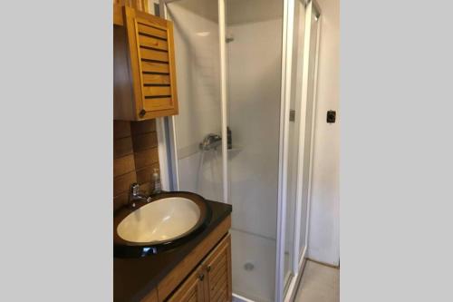 a bathroom with a sink and a shower at House with a warm soul in North Iceland in Siglufjörður