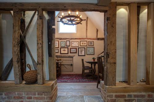 a hallway in a house with wooden beams at The Ferry Boat Inn in North Fambridge