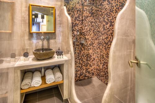 a bathroom with a shower and a sink at Villa Eleftheria in Perivolos