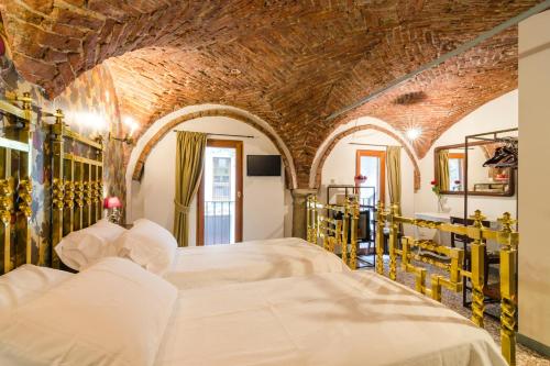 Postel nebo postele na pokoji v ubytování Ca' Monteggia Guest House
