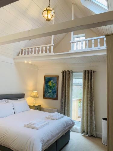 a bedroom with a bed in a room at Shepherds House in Swanage