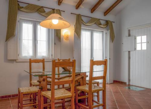 a dining room with a table and chairs at Monte do Giestal - Casas de Campo & Spa in Abela