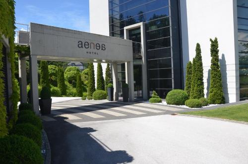 a building with a sign that reads acs at Suiten-Aparthotel AENEA in Reifnitz