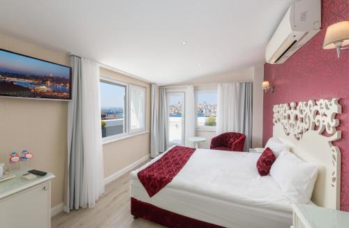 a hotel room with a bed and a large window at Dream Bosphorus Hotel in Istanbul