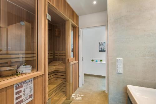 a bathroom with a sink and a toilet in it at Dock 76 Bridge - Penthouse in Olpenitz