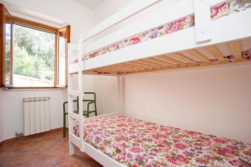 Ένα ή περισσότερα κρεβάτια σε δωμάτιο στο Casa Carlotta - Goelba