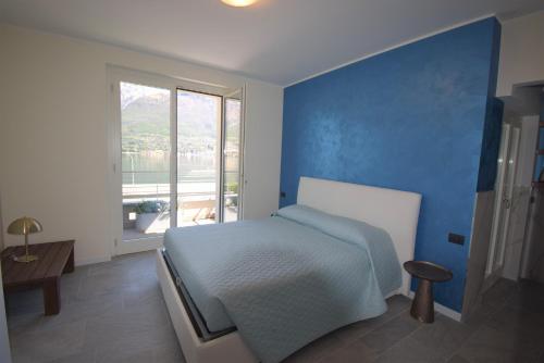 Ένα ή περισσότερα κρεβάτια σε δωμάτιο στο Apt Jolanda Bellagio Wild Flowers