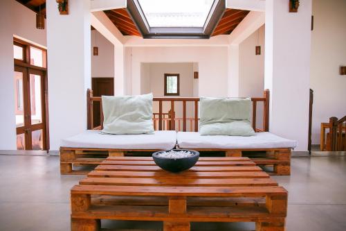 a room with two beds and a bowl on a table at Battaramulla Boutique Villa in Sri Jayewardenepura Kotte