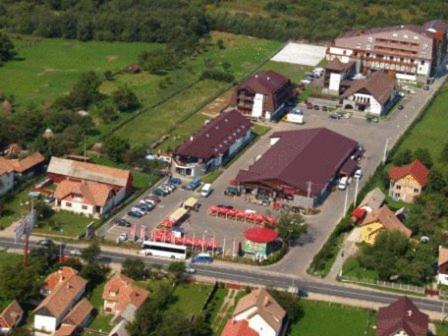 an aerial view of a small town with a parking lot at New Wolf in Bran