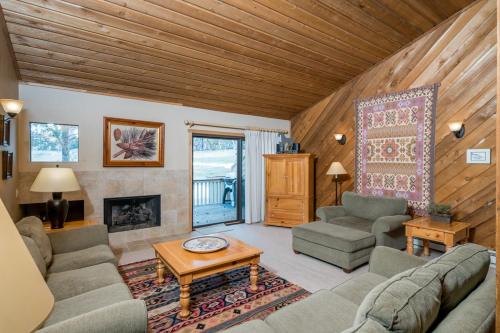 a living room with a couch and a fireplace at Ridge - 2682 in Elkhorn Village