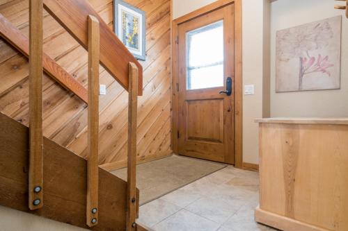 a staircase in a house with a wooden door at Ridge - 2682 in Elkhorn Village