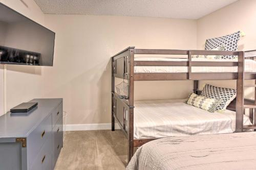 a bedroom with two bunk beds and a desk at Walk to Beach Lake Havasu Condo with Pool Access in Lake Havasu City