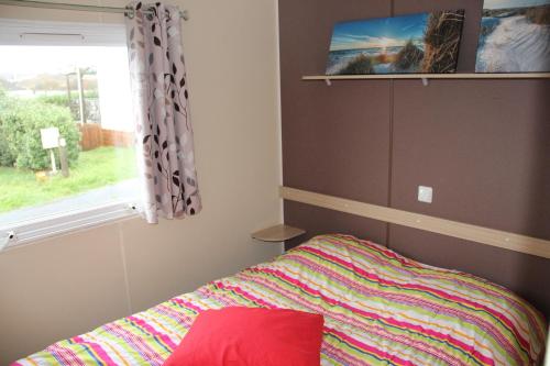 Кровать или кровати в номере Mobil Home "La vague reposante"