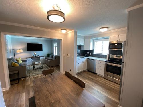 a kitchen and living room with a couch and a table at Steps away from the BEACH!!! in Hilton Head Island