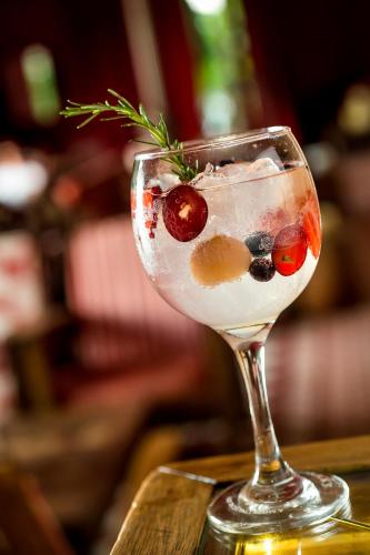 a drink in a martini glass on a table at Aparthotel Adagio London Sutton Point in Sutton