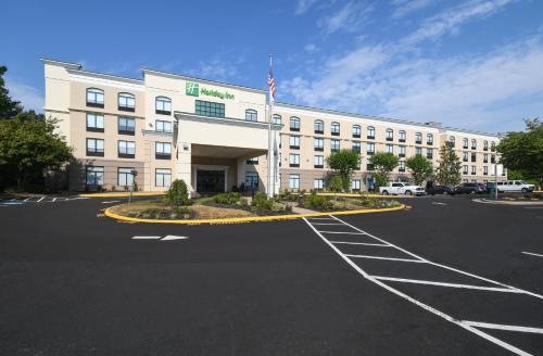 an empty parking lot in front of a hotel at Holiday Inn Fredericksburg - Conference Center by IHG in Fredericksburg