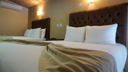 Postel nebo postele na pokoji v ubytování Hotel Poza Blanca Lodge