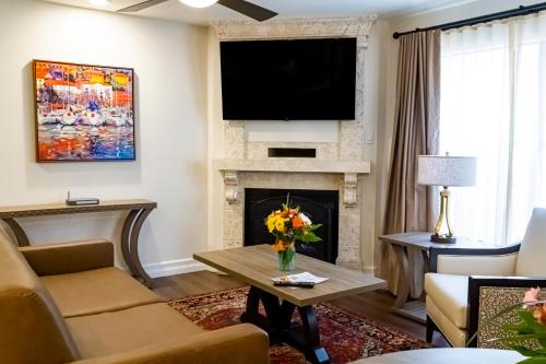 a living room with a fireplace and a flat screen tv at Westgate Flamingo Bay Resort in Las Vegas