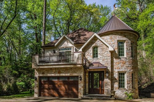 a stone house with a balcony on top of it at Eagles Nest in New Buffalo